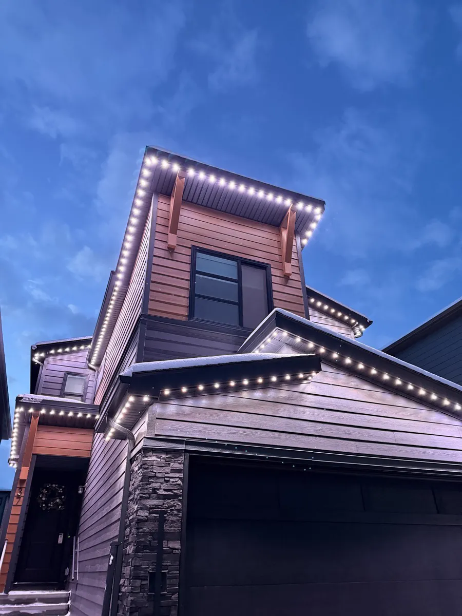 The same home in bright white security lighting