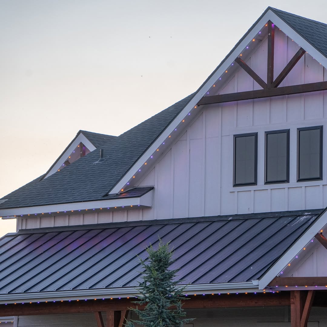 Permanent LED roofline lighting on two-storey Calgary home at night