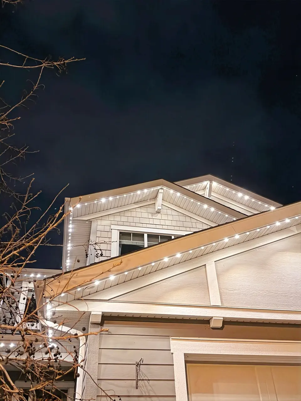 Permanent accent lighting along home exterior and eaves of Calgary suburban home