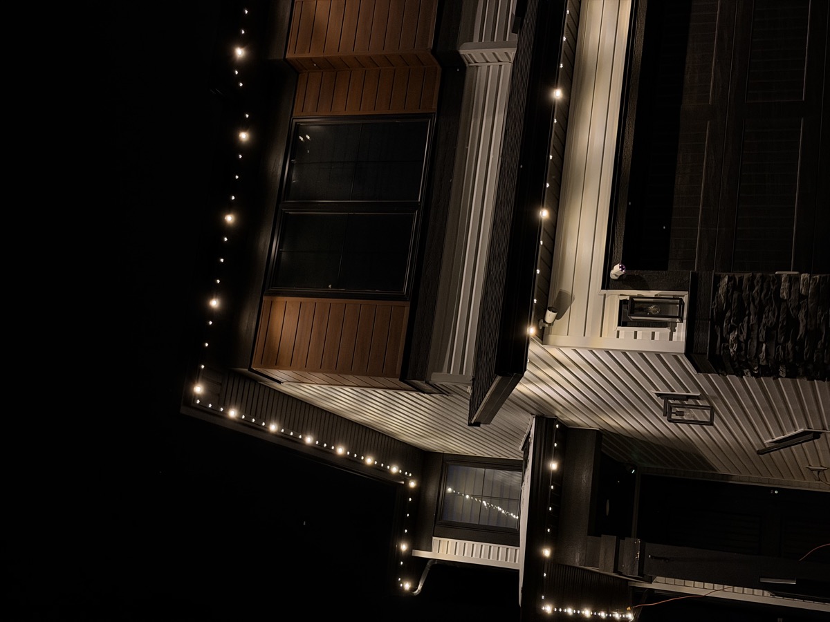 Permanent white LED lights accentuating Calgary home exterior after dark