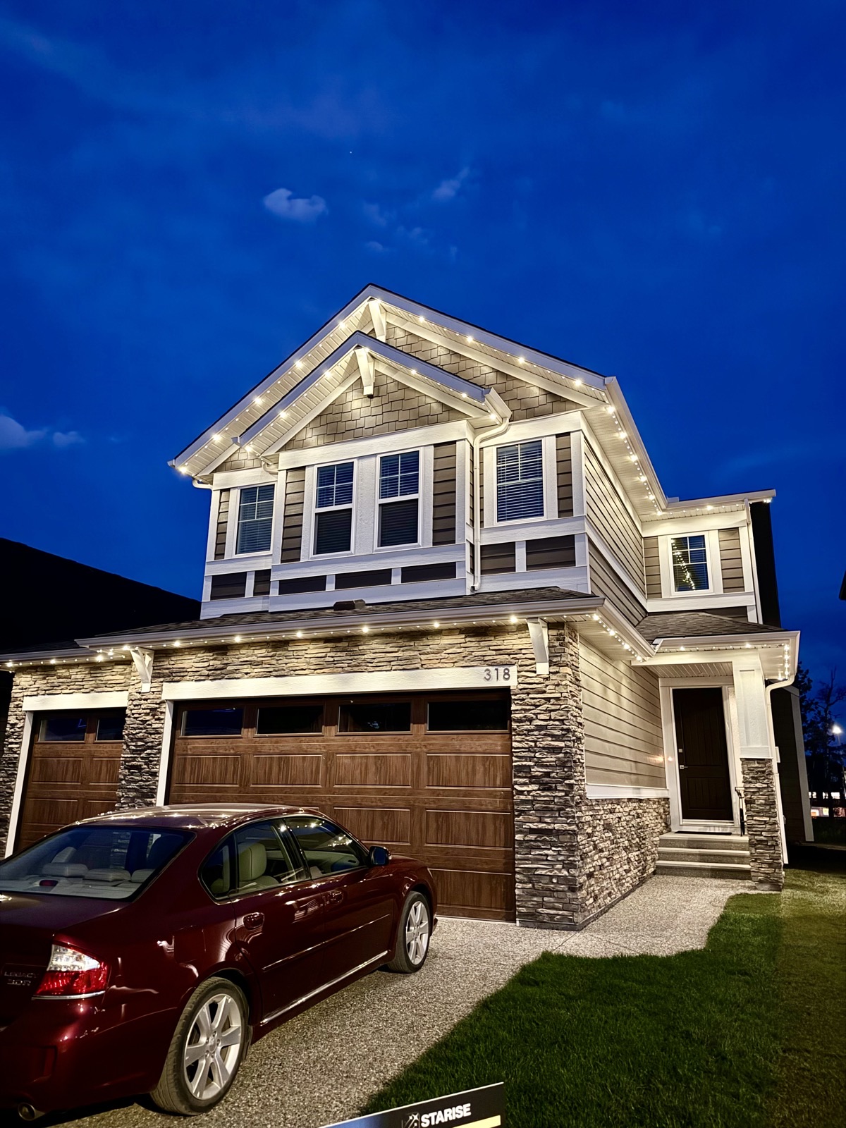 Permanent LED soffit lights creating warm ambiance on Calgary home