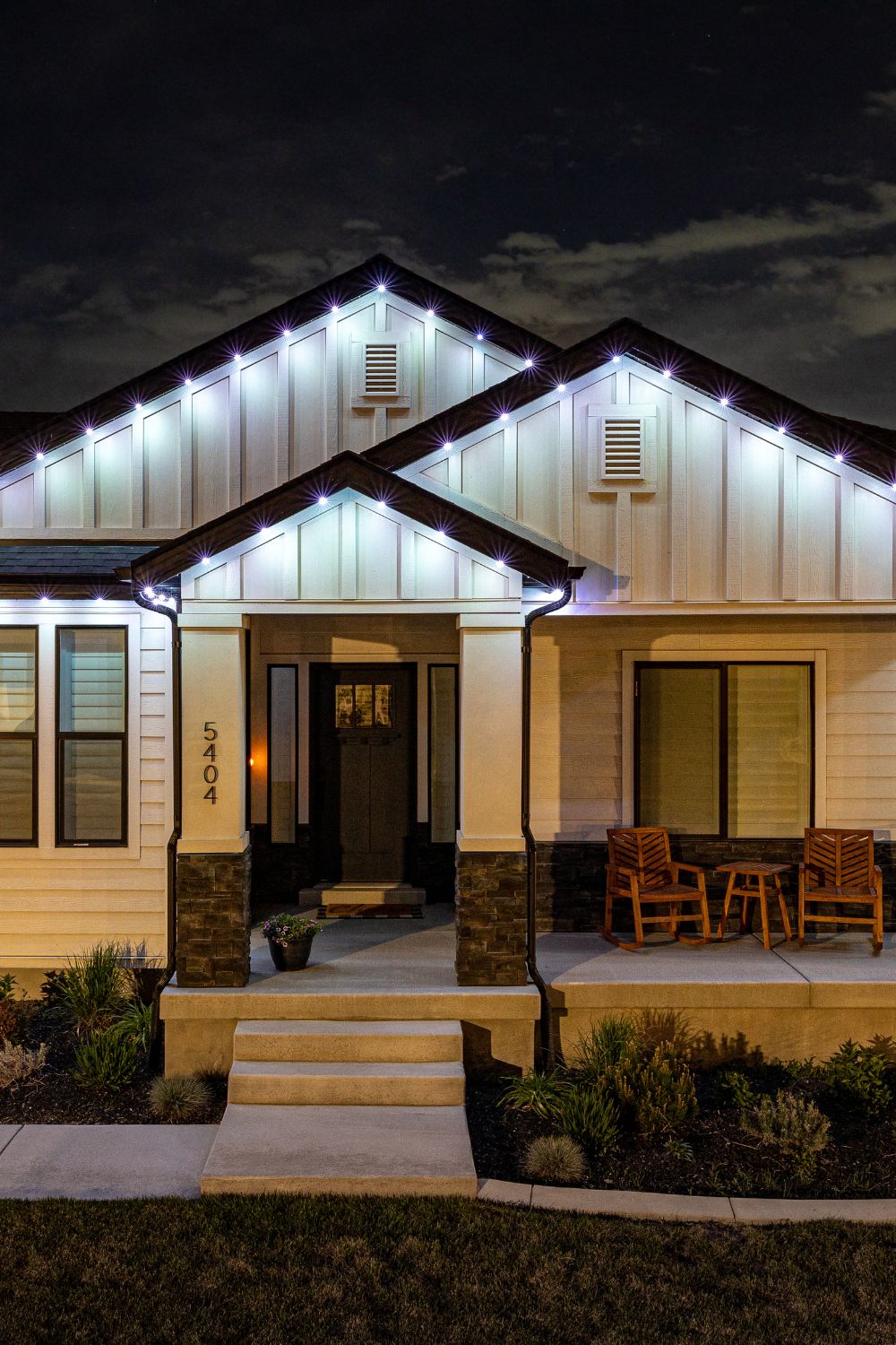 Clean permanent accent lighting installation along Calgary home eavestroughs