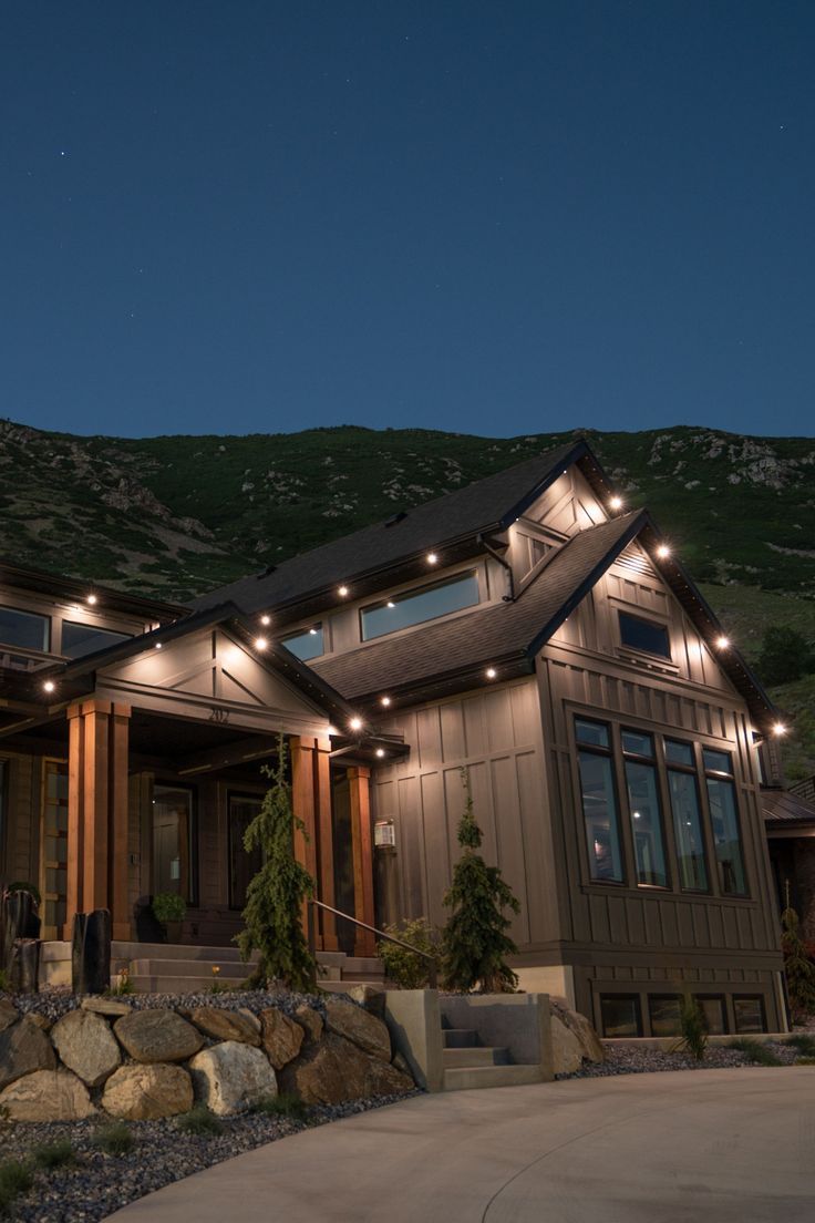 Subtle permanent LED downlights on Calgary home exterior walls and roofline