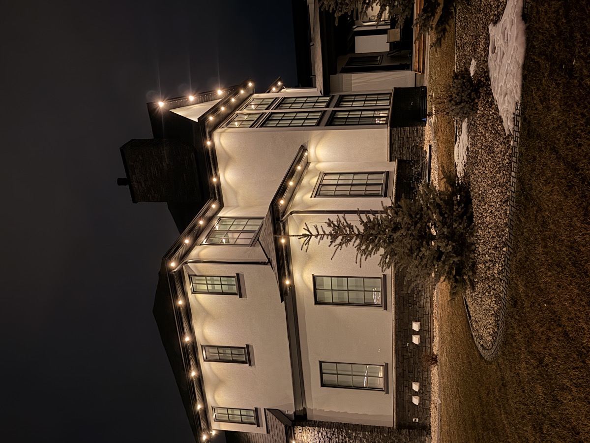 Permanent outdoor LED lights on Calgary home with front porch and columns