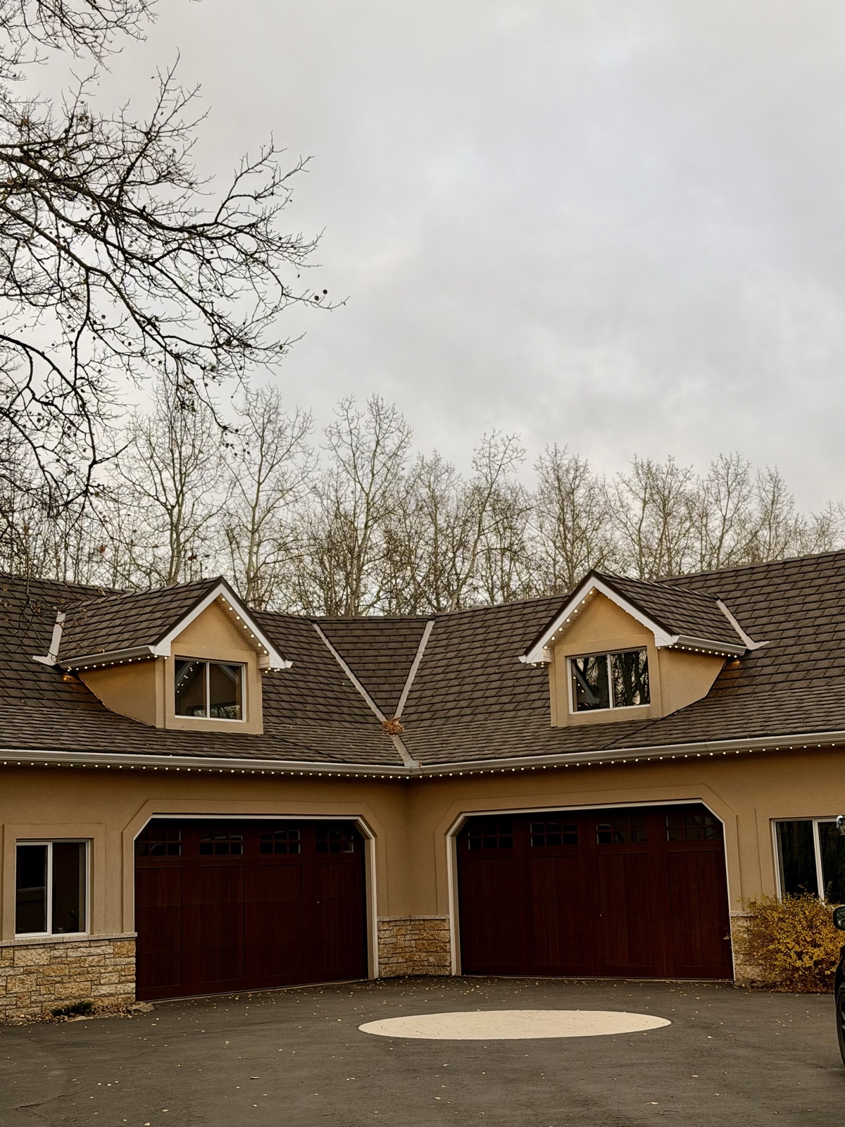 Permanent accent lighting on Calgary home with attached triple garage