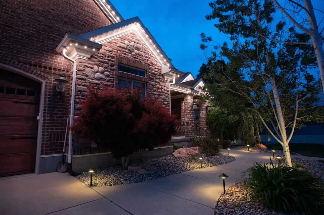 Teal and purple permanent LED lights on modern Calgary home exterior at dusk