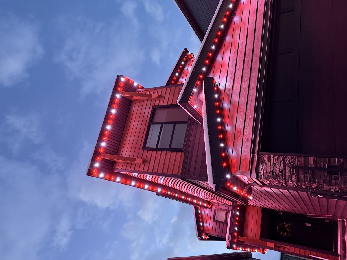 Permanent LED lights creating rainbow effect for Pride celebration on Calgary home