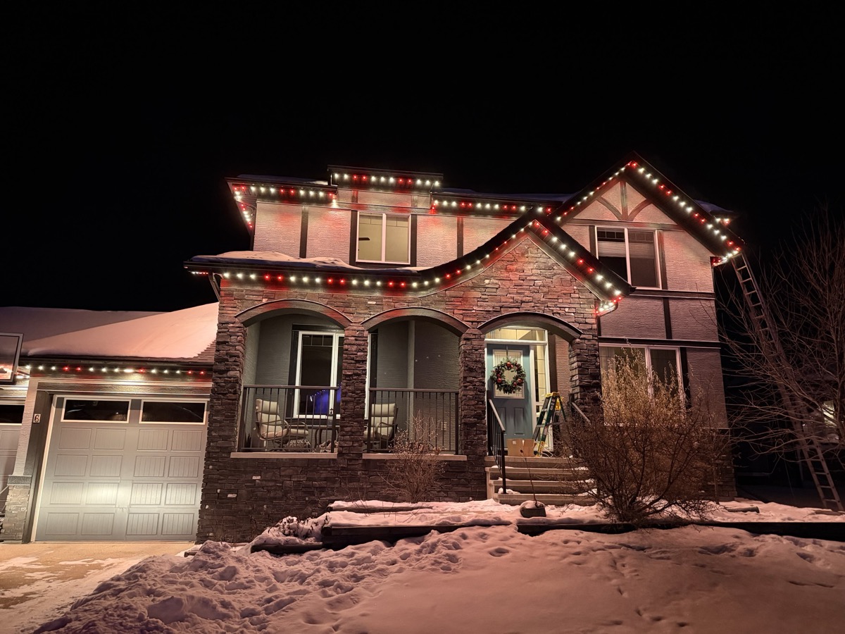 Green permanent LED lighting for St Patrick Day celebration on Calgary home