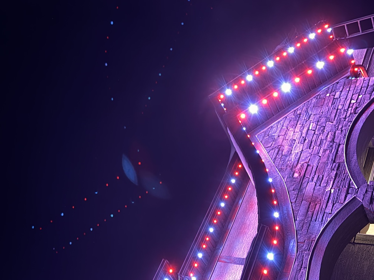 Permanent outdoor lights in blue and silver for winter event on Calgary home