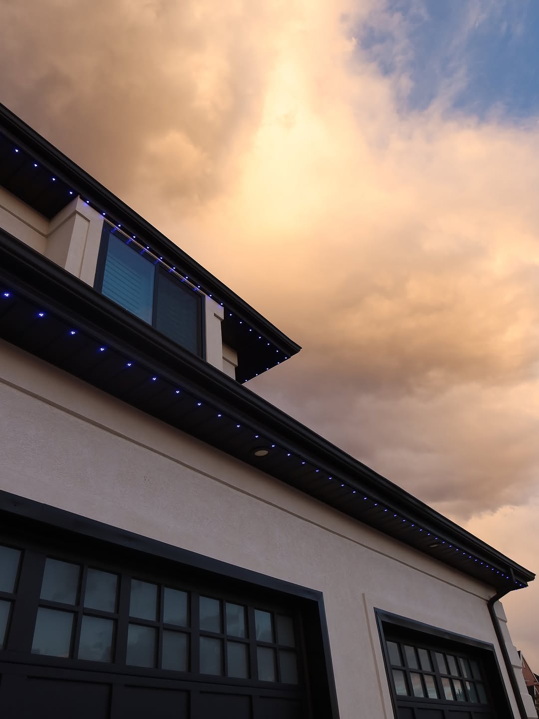 Dynamic colour-changing permanent LED lights for backyard party on Calgary home