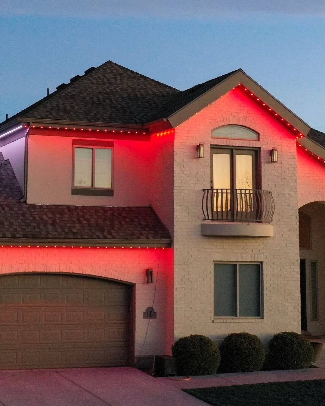 Purple and gold permanent LED event lighting on Calgary residential property