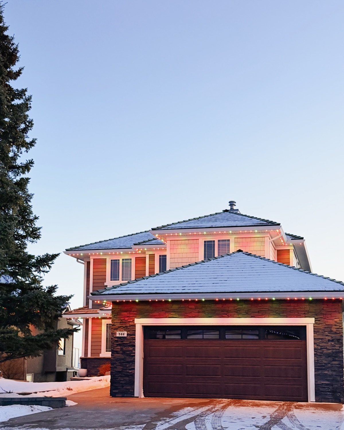 Calgary home with permanent LED lights set to classic Christmas colour scheme