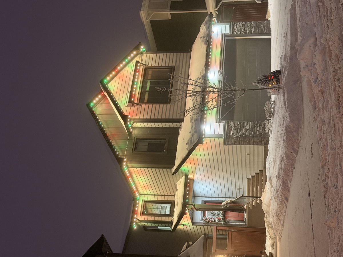 Permanent Christmas lighting in blue and white theme on Calgary residence