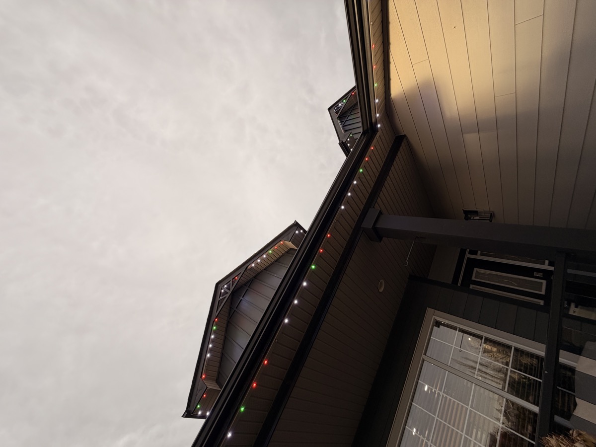Festive permanent LED lights with holiday patterns on Calgary family home