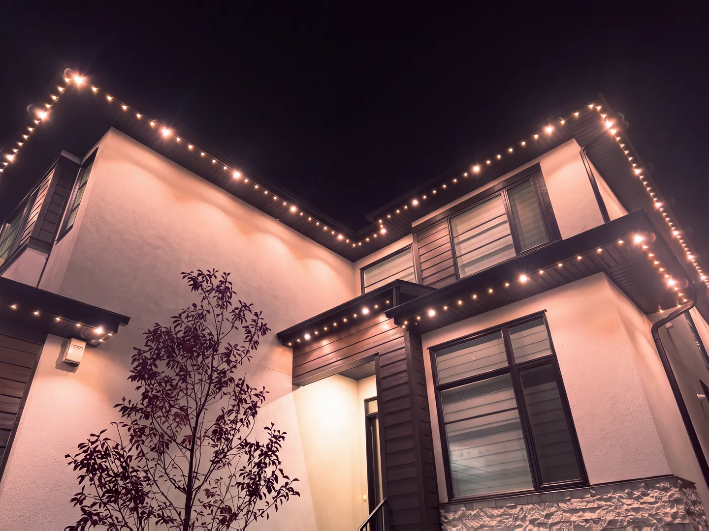 The same home in warm white permanent lighting