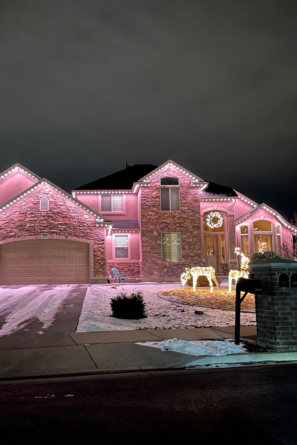 Full-perimeter permanent LED security lighting on Calgary corner-lot home