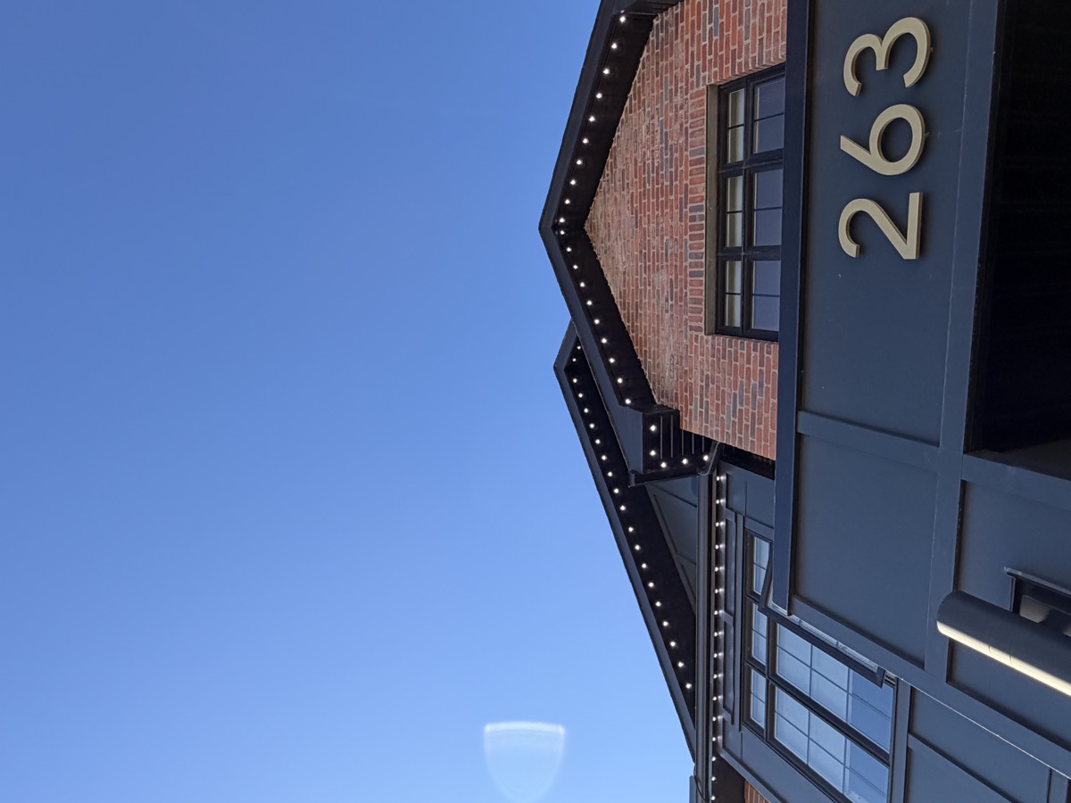 Permanent outdoor security lighting on rear elevation of Calgary residential home