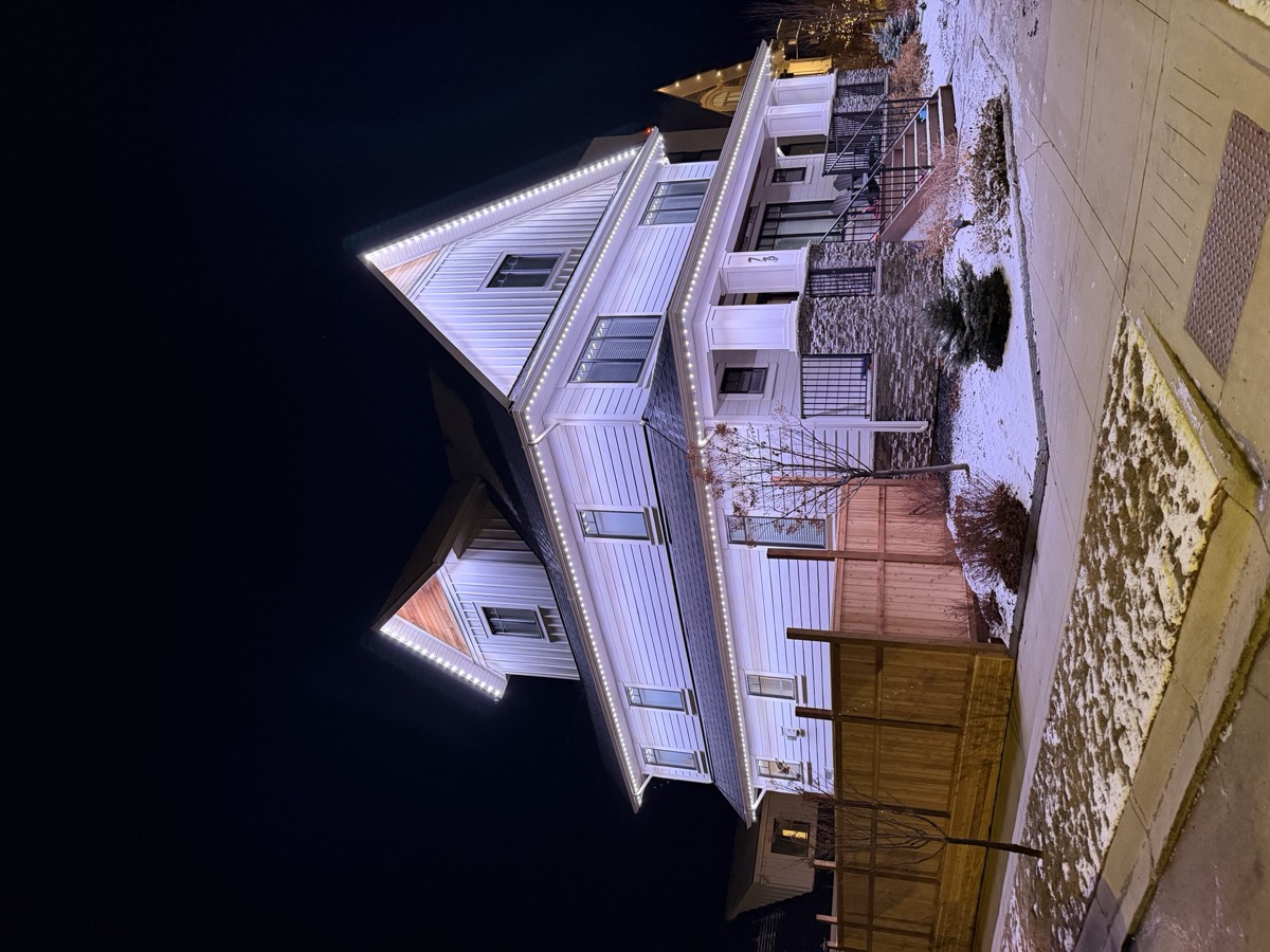 All-night permanent LED security lighting on Calgary home backyard and fence line