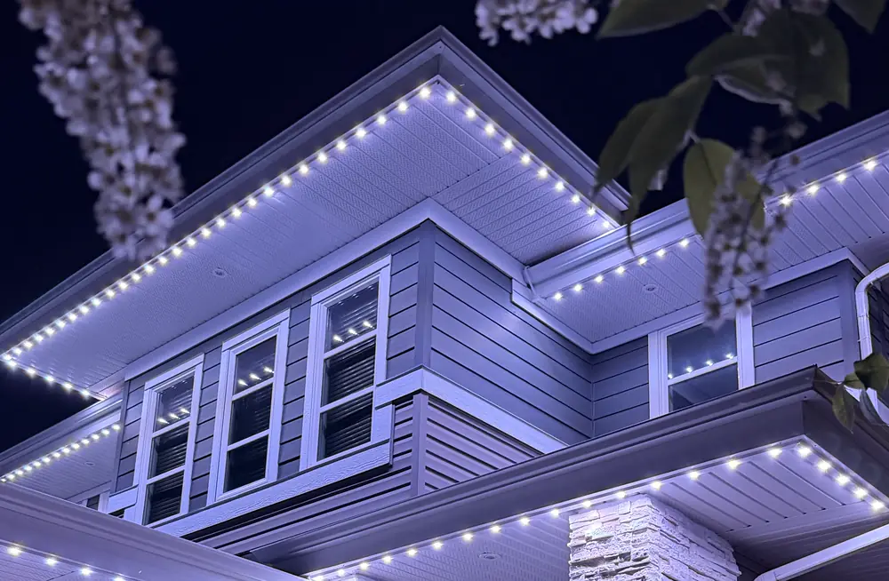 Evenly spaced Starise lights along a soffit at night